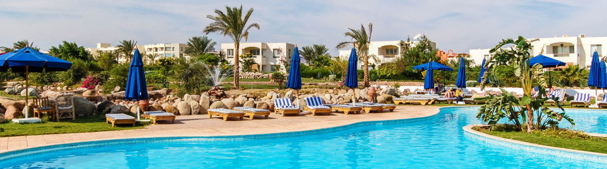 swimming-pool-at-popuar-hotel-sharm-el-sheikh-egypt-shutterstock_29834413-2-1200×335