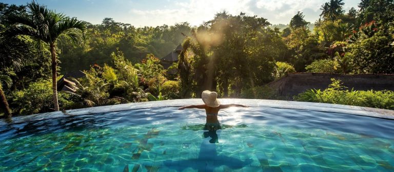 Bali-Infinity-PoolWoman-sunbathing-in-infinity-swimming-pool-at-luxurious-resort-shutterstock_489675709-smaller