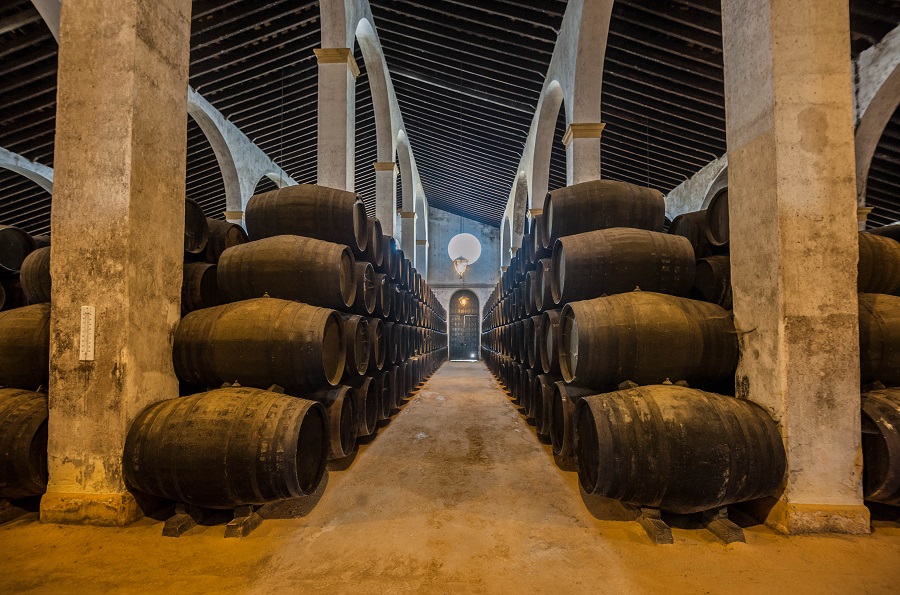 Andalusien;Sherry barrels line a walkway in a bodega in Jerez, Spain