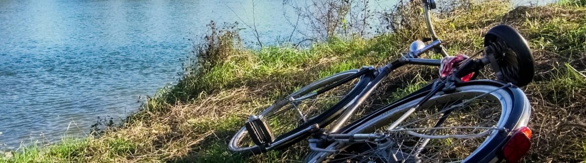 Bicycle-on-the-ground-along-the-bank-of-river-Ticino_shutterstock_295161650-1