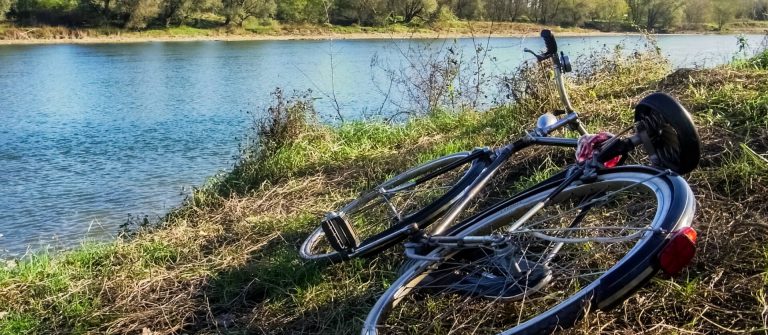 Bicycle-on-the-ground-along-the-bank-of-river-Ticino_shutterstock_295161650-1