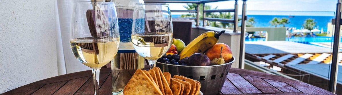 wine-with-snack-on-a-background-of-the-sea-istock_000067897009_medium-2-1