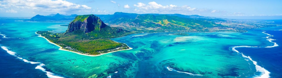 Aerial-view-of-Mauritius-island-panorama-and-famous-Le-Morne-Brabant-mountain-beautiful-blue-lagoon-and-underwater-waterfall-shutterstock_733185379_1920